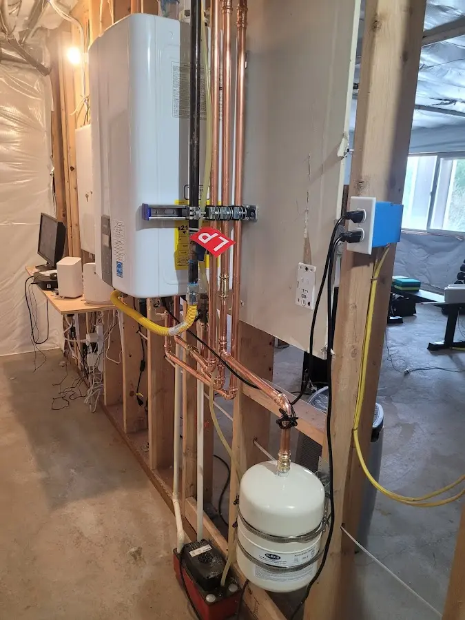 Licensed plumber repairing a kitchen sink in Iowa City