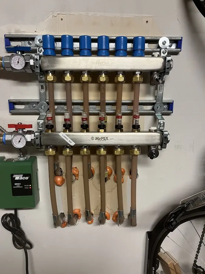 Plumber performing Gas Line Installation at a residential property in Iowa City